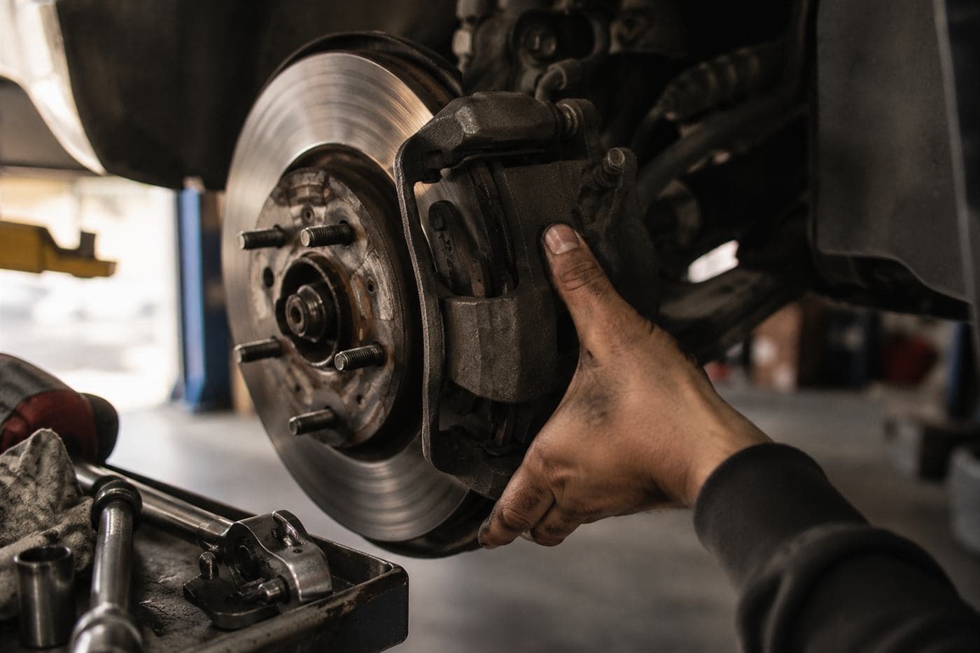 Brake caliper and rotor inspection at B&R Auto Repair in Crystal, MN