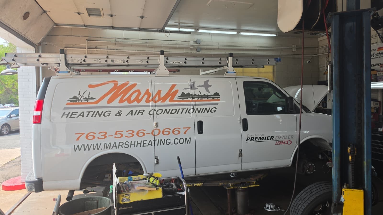 Vehicle being serviced inside B&R Auto Repair